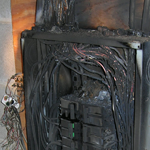 Repairing a panel after an electrical fire.